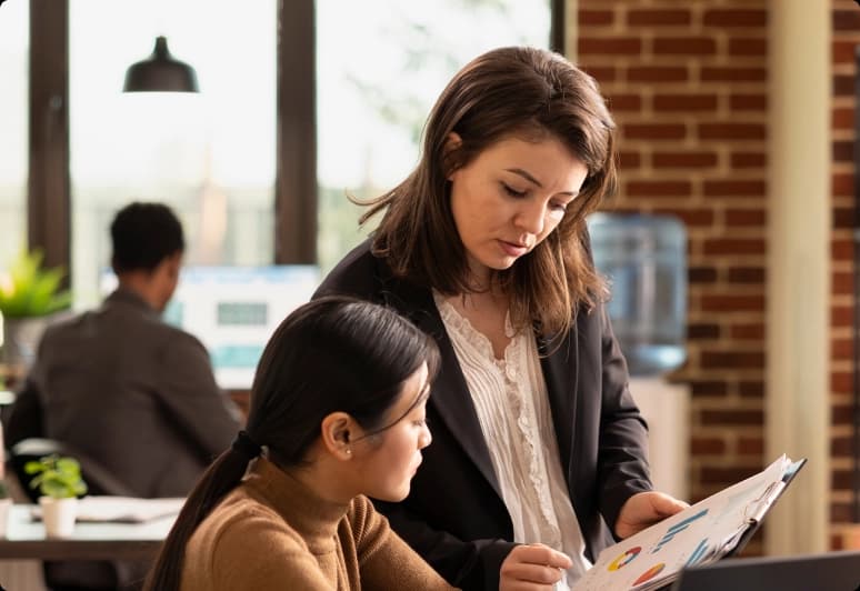 Equals team members collaborating at a desk