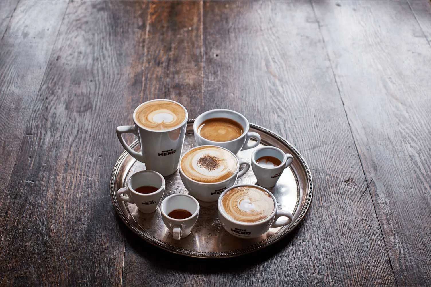 A tray of Caffè Nero coffees in branded cups