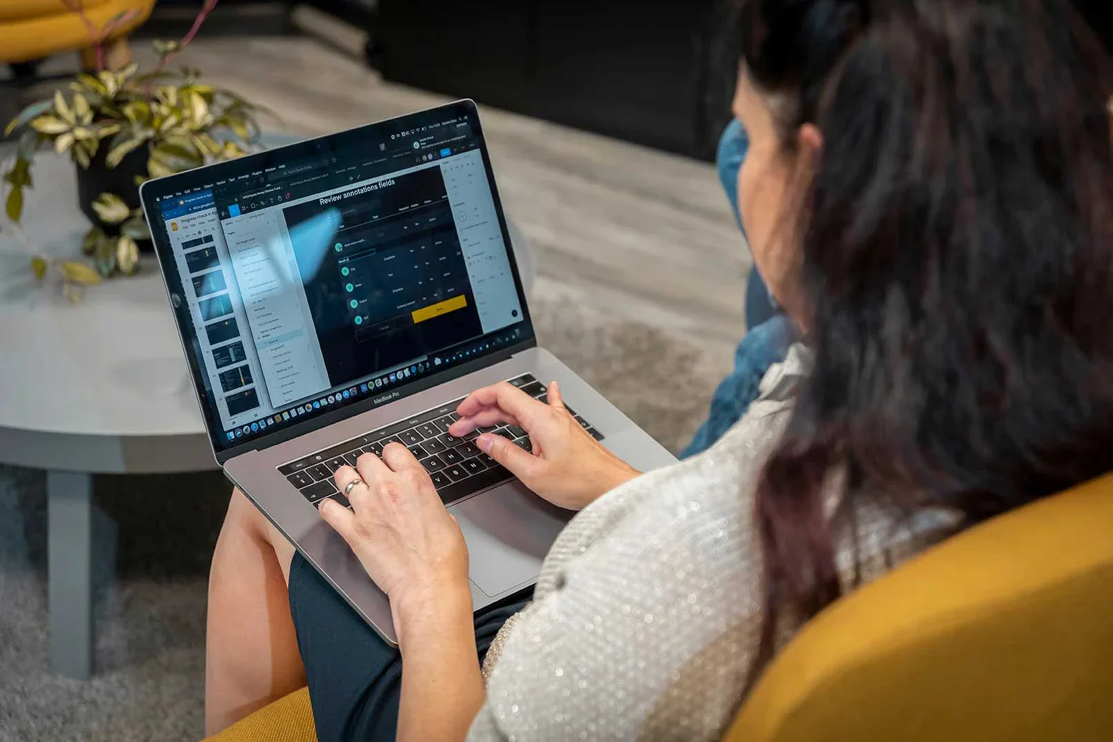 An Equals team member working on a laptop in the office