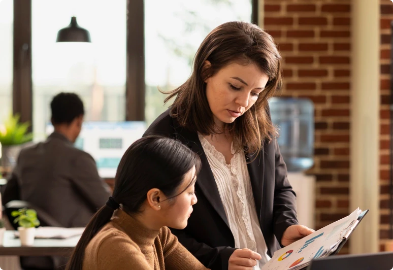 Equals team members collaborating at a desk