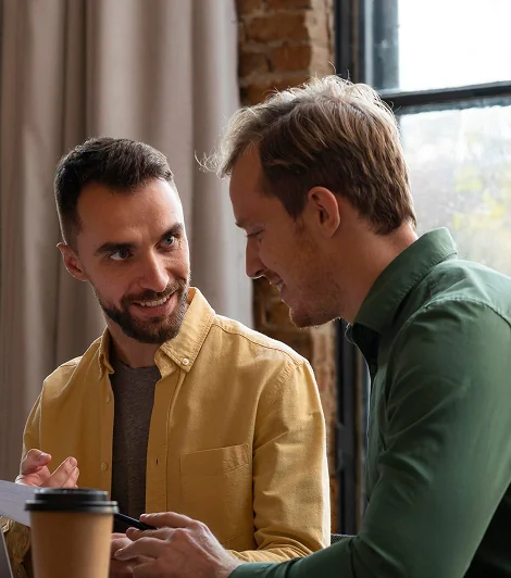 Equals team members chatting over coffee